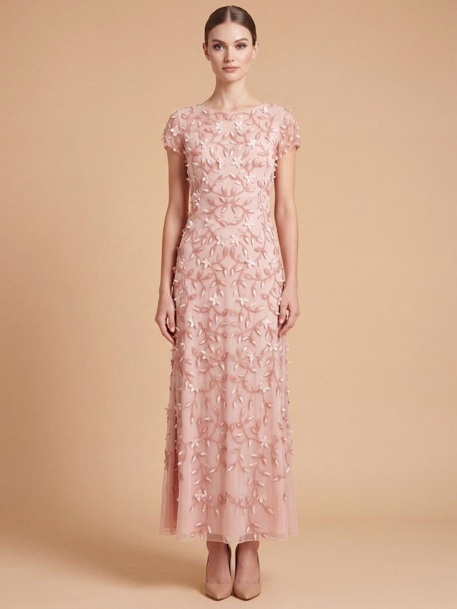 Lara 28850 in peach rose, with a rounded neckline, cap sleeves and raised floral details