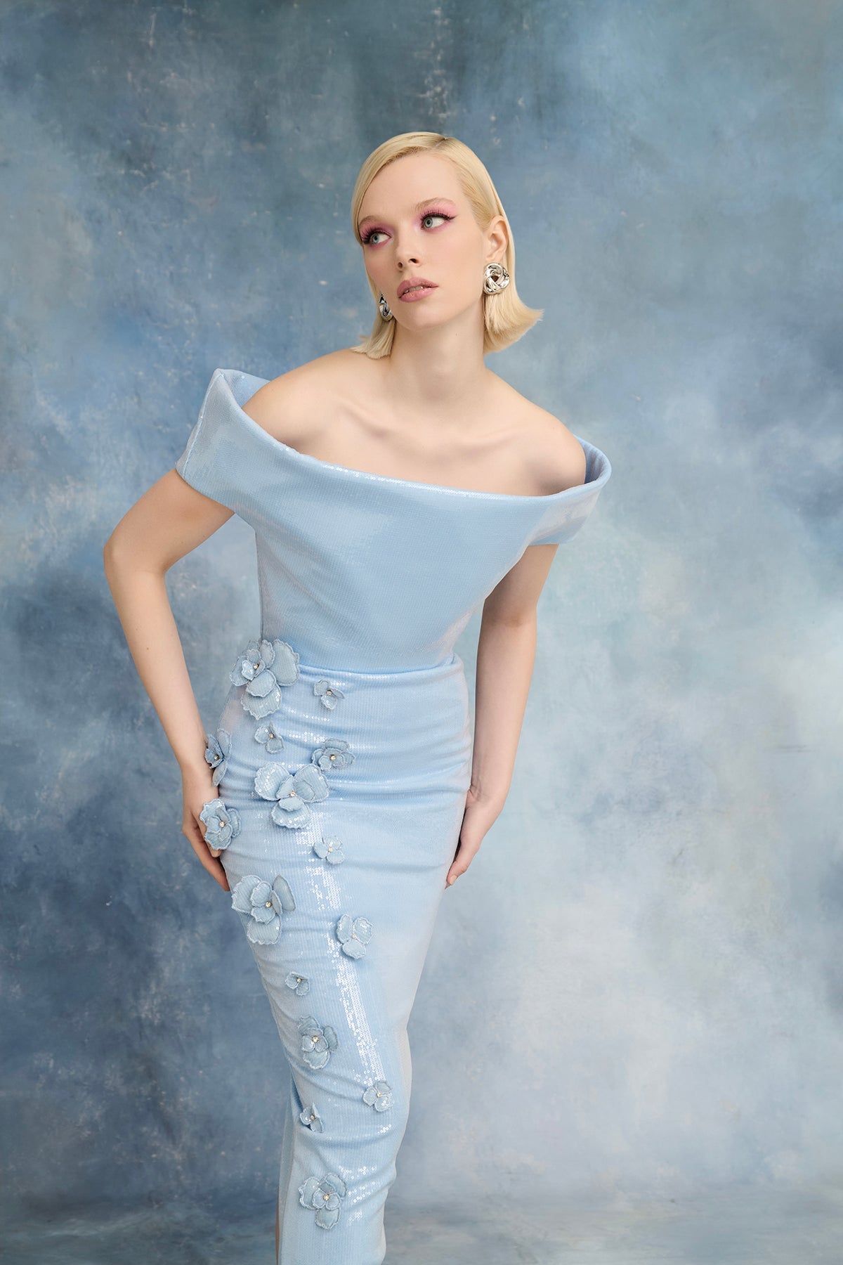 نور فتح الله N0723 - فستان أزرق فاتح مزين بالترتر مع تطريزات زهرية