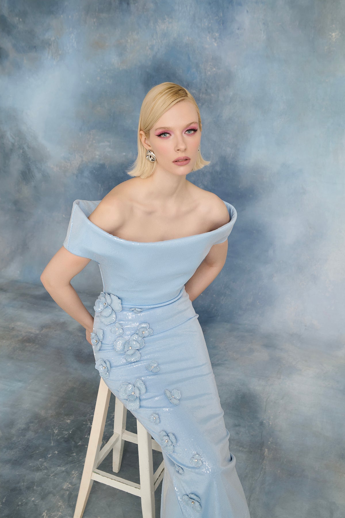 نور فتح الله N0723 - فستان أزرق فاتح مزين بالترتر مع تطريزات زهرية