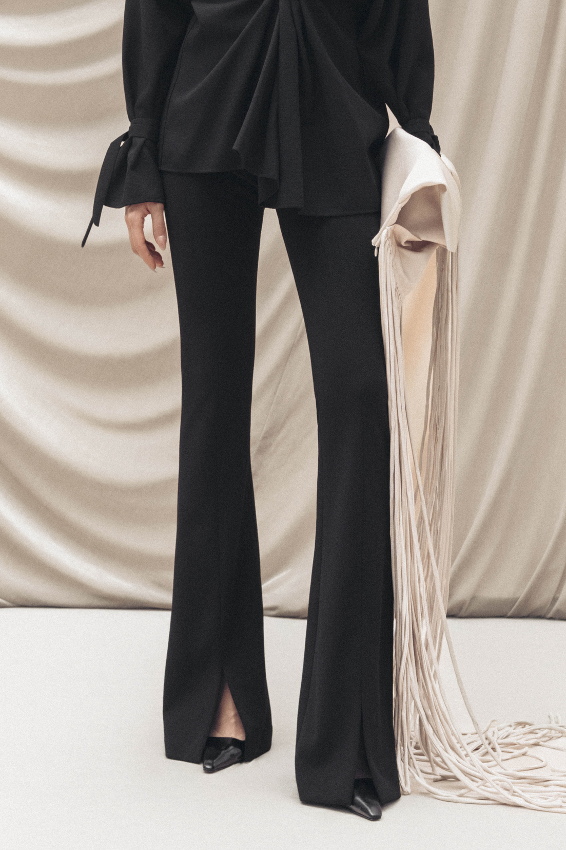 Cross-Hem Flared Pants in Black