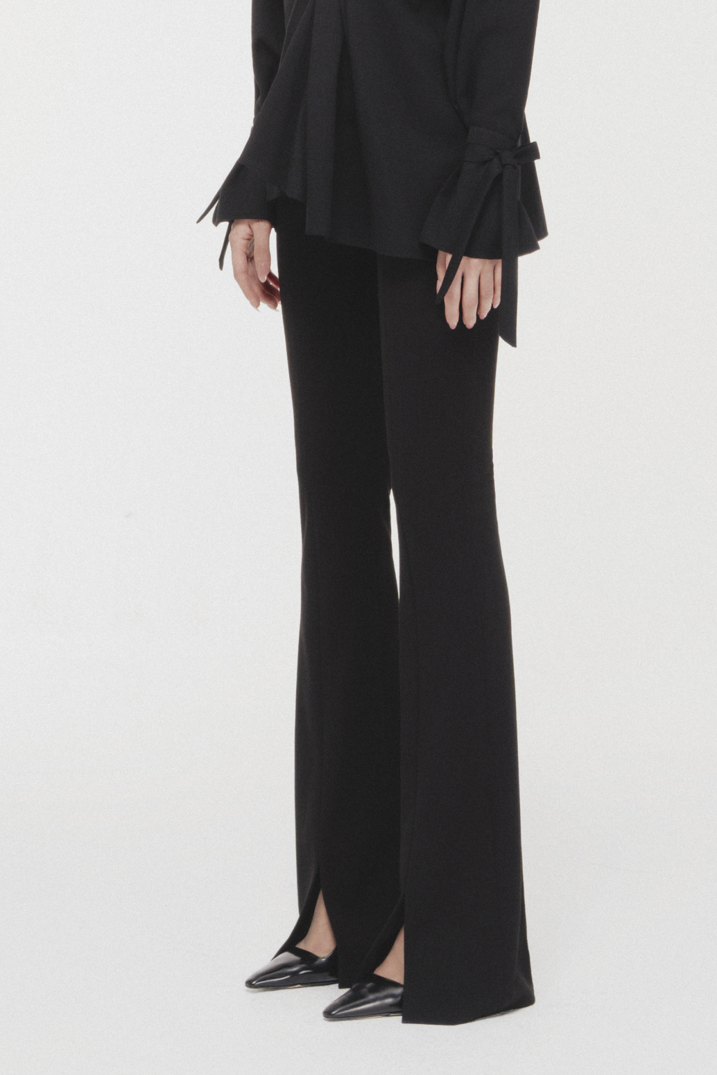 Cross-Hem Flared Pants in Black