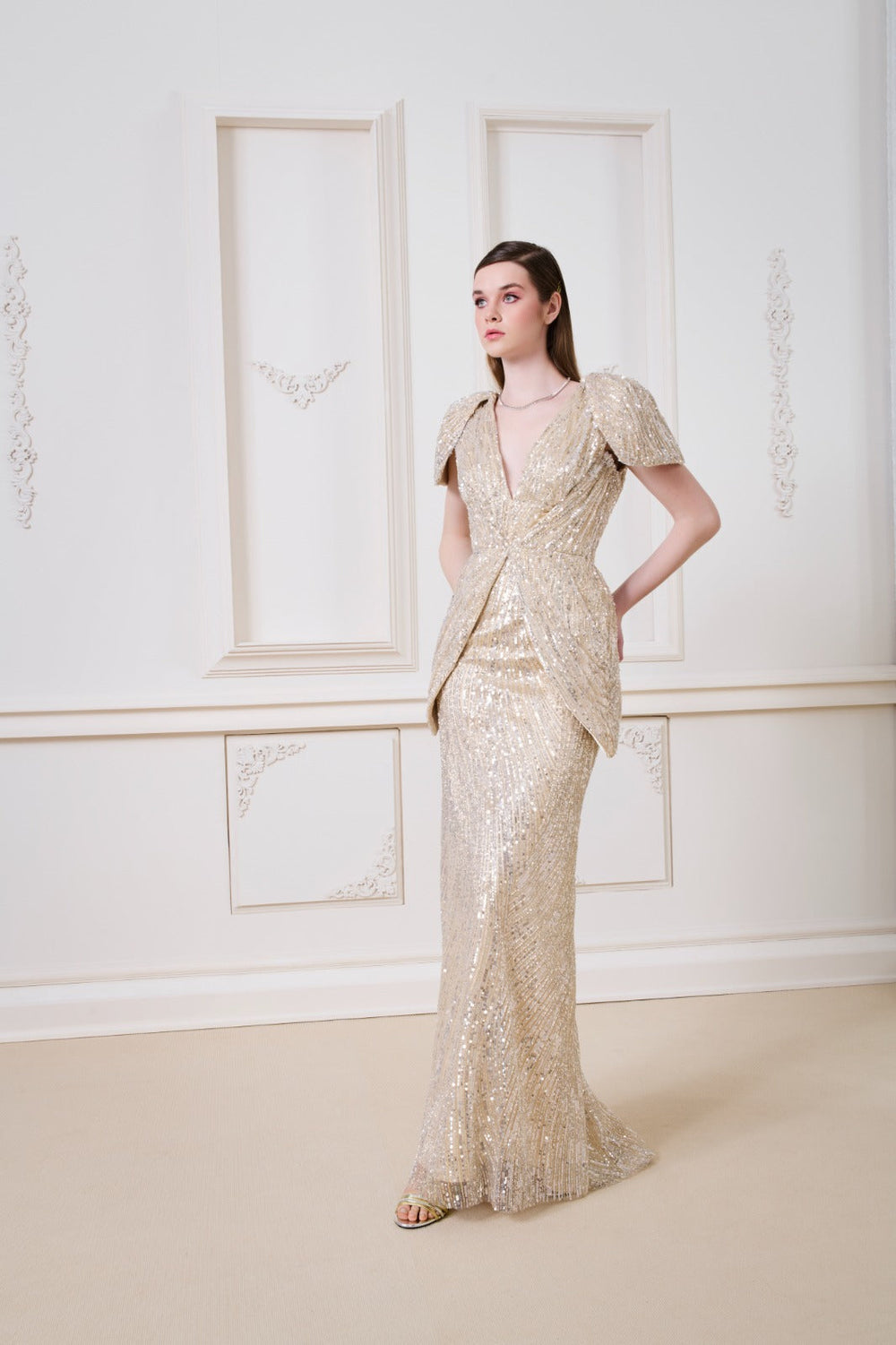 Li Beirut M1138 – Gold Sequin Deep V Evening Gown with Sculptural Hip Panels
