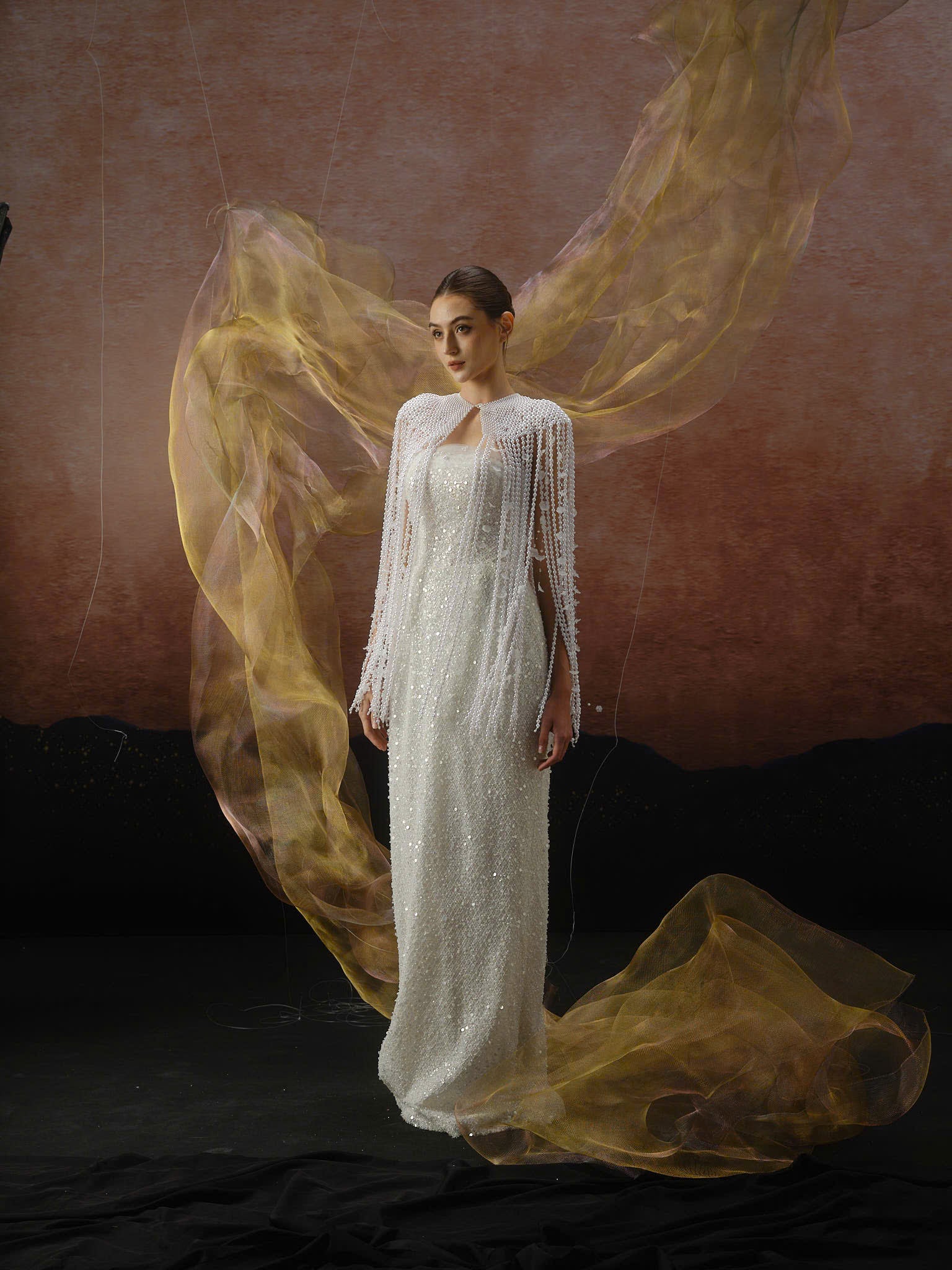 Linh Nga LMBCT298 – Strapless Beaded Gown with Sheer Cape Overlay