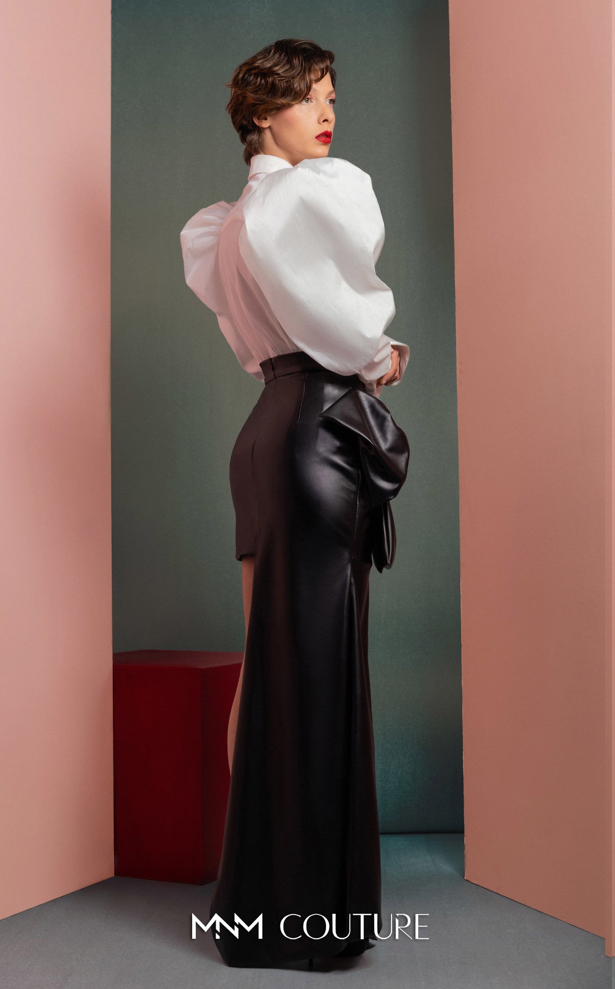 Style GOF2502 Puff-Shoulders Taffeta Blouse with Pleated Front Asymmetrical Leather Skirt with Bold Side Bow