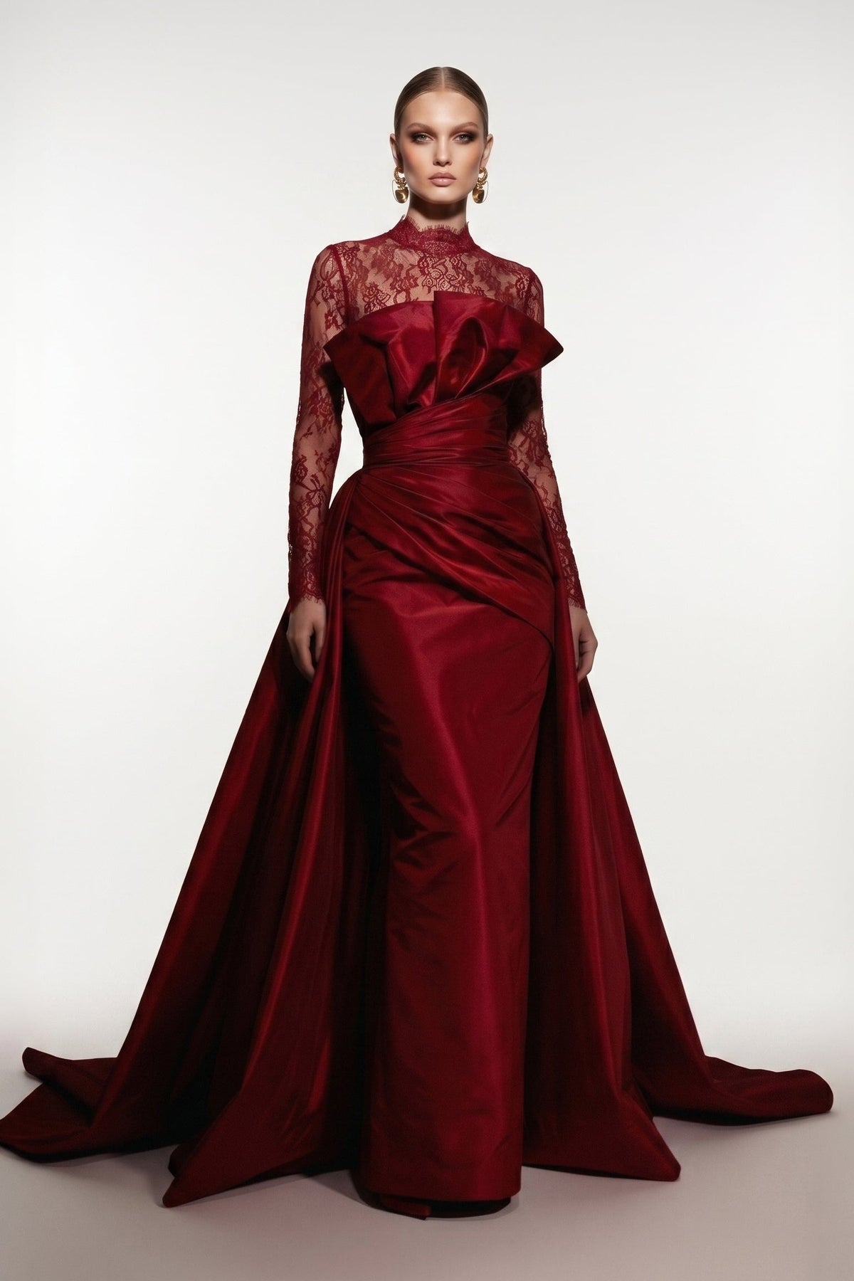 Fouad Sarkis F03006A gown with an illusion lace high neckline, sheer long sleeves and sculpted satin folds