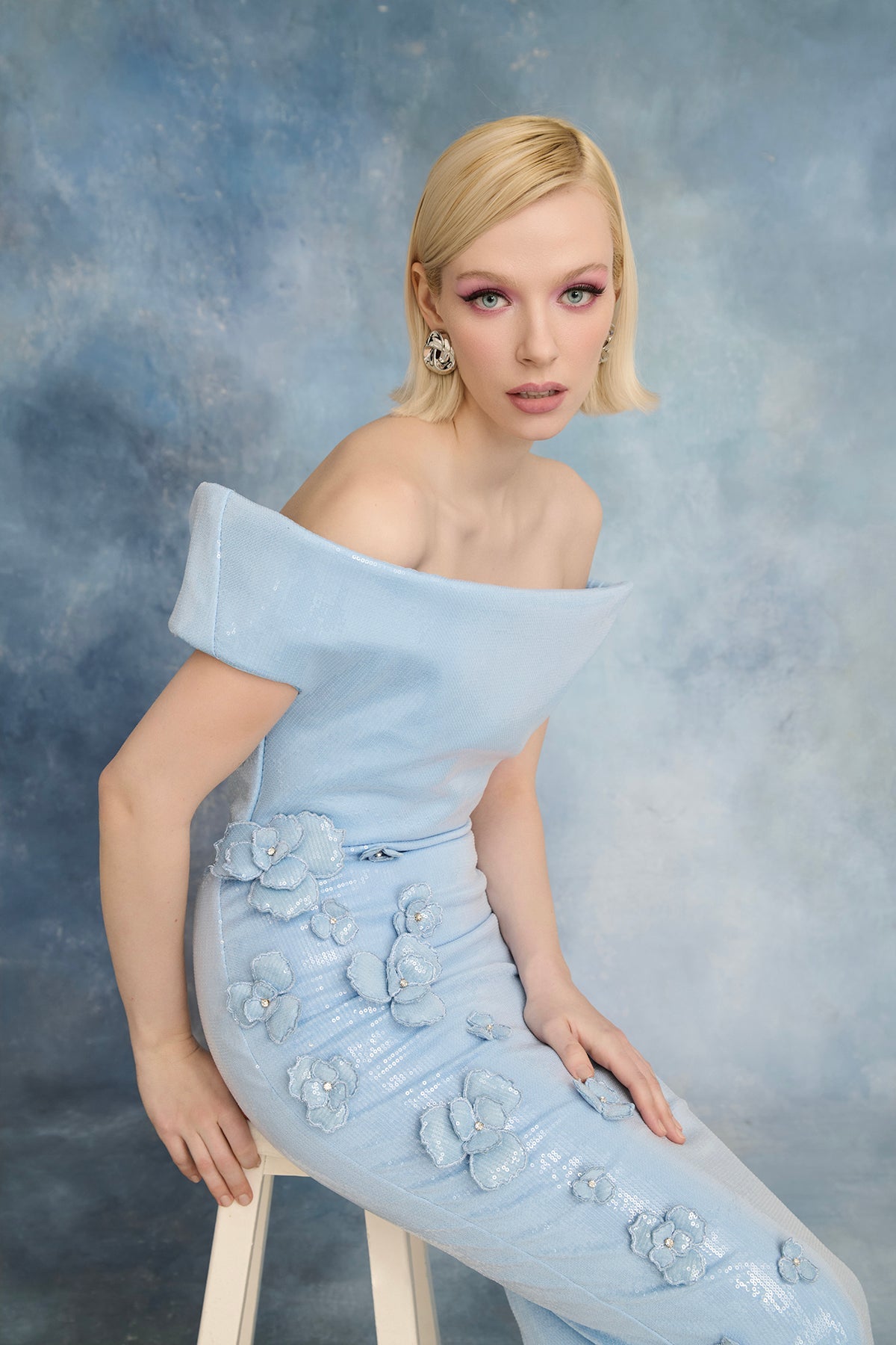 نور فتح الله N0723 - فستان أزرق فاتح مزين بالترتر مع تطريزات زهرية