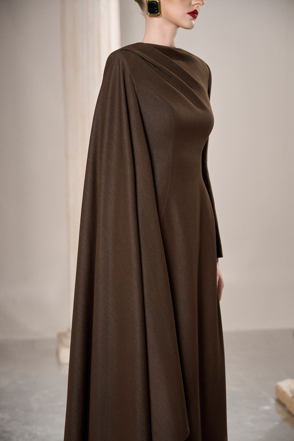 Dress Fitted column gown, draped neck, dramatic side cape