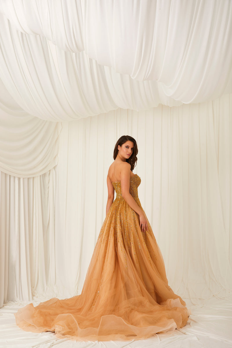 Li Beirut M1002 – Strapless Embellished Gold Ball Gown with Beaded Cape Overlay