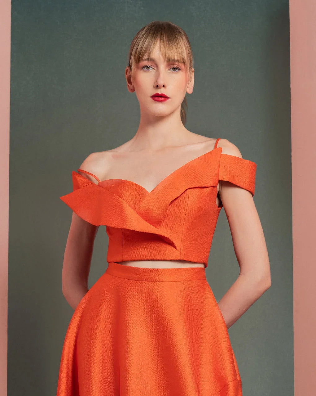 Style GOF2537 Vibrant Orange Off-Shoulder Cropped Top Asymmetrical High-Low Skirt with Elegant Draping