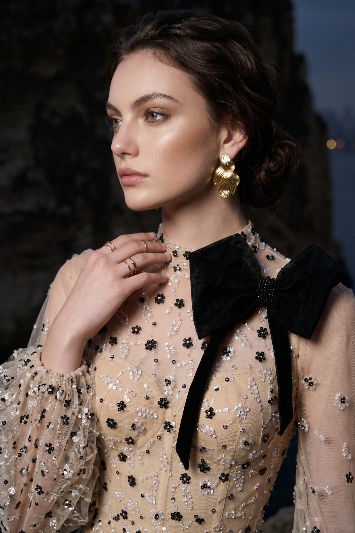 Li Beirut M1104 – High-Neck Illusion Gown with Floral Embellishments, Statement Bow & Sheer Sleeves